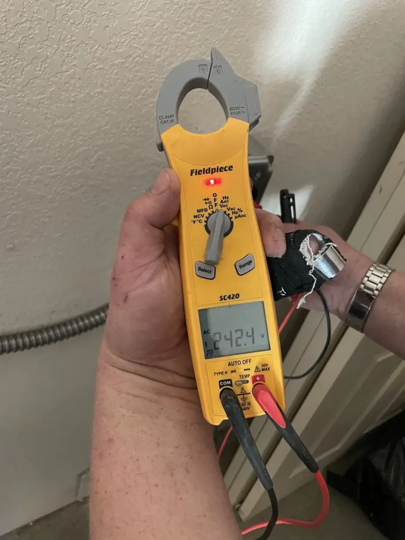 Voltage testing with clamp meter during Outlet Installation in Scottsbluff